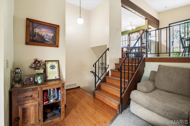 1739 Fairfax Dr, Barnhart, MO 63012 - stairs featuring wood finished floors and a chandelier