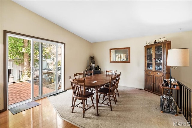1739 Fairfax Dr, Barnhart, MO 63012 - dining room featuring light wood finished floors and vaulted ceiling