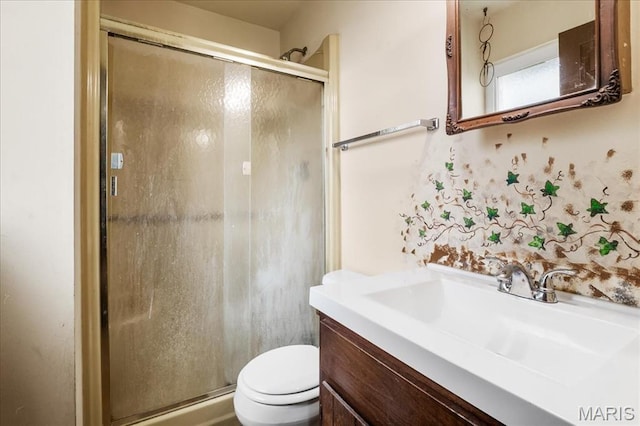 1739 Fairfax Dr, Barnhart, MO 63012 - bathroom featuring toilet, vanity, and a stall shower