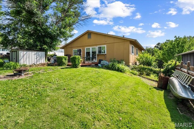 1739 Fairfax Dr, Barnhart, MO 63012 - rear view of house featuring a wooden deck and a yard