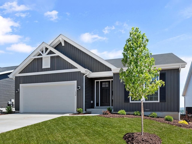 view of front of home with a garage, a front yard, concrete driveway, and board and batten siding