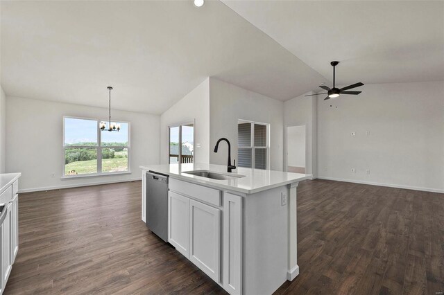 kitchen featuring a sink, stainless steel dishwasher, lofted ceiling, open floor plan, and a chandelier