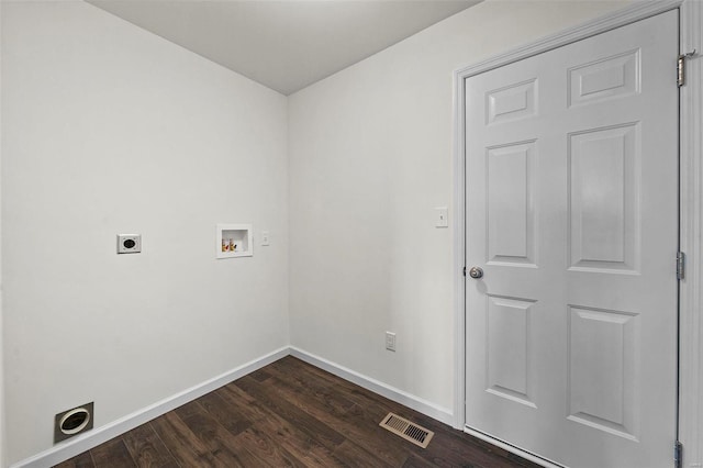 washroom with electric dryer hookup, hookup for a washing machine, baseboards, and dark wood finished floors