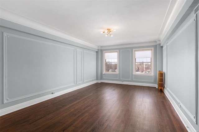4440 Lindell Blvd Unit 701, Saint Louis, MO 63108 - empty room with radiator heating unit, dark wood-style floors, a decorative wall, ornamental molding, and a chandelier