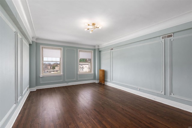 4440 Lindell Blvd Unit 701, Saint Louis, MO 63108 - unfurnished room with a chandelier, dark wood-style flooring, baseboards, crown molding, and a decorative wall