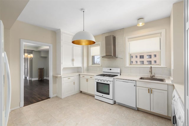 4440 Lindell Blvd Unit 701, Saint Louis, MO 63108 - kitchen featuring a sink, white appliances, wall chimney exhaust hood, light countertops, and a chandelier