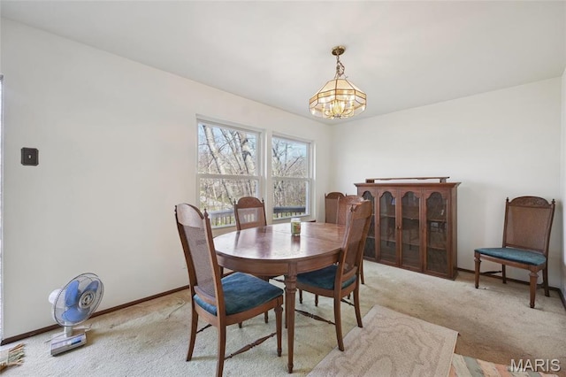 32 Oak Forest Dr, Saint Charles, MO 63303 - dining room featuring a chandelier and light colored carpet