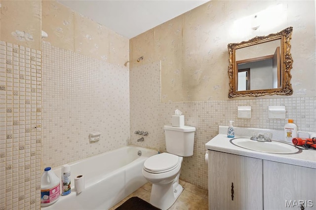 32 Oak Forest Dr, Saint Charles, MO 63303 - bathroom featuring tile walls, vanity, shower / bathtub combination, tile patterned flooring, and a wainscoted wall