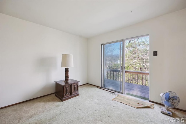 32 Oak Forest Dr, Saint Charles, MO 63303 - unfurnished living room featuring carpet flooring and baseboards