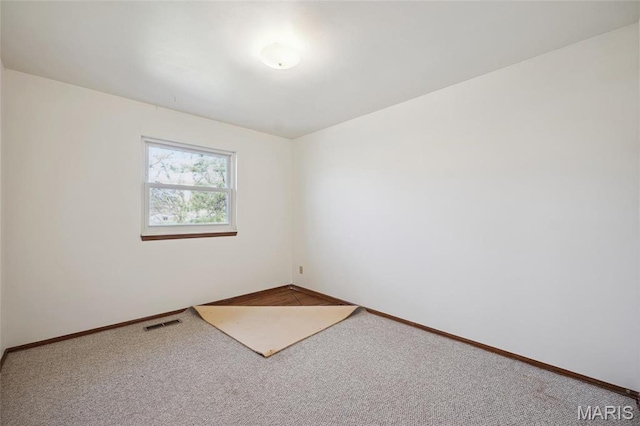 32 Oak Forest Dr, Saint Charles, MO 63303 - carpeted spare room with baseboards