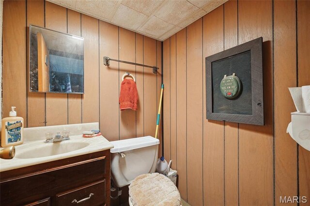 32 Oak Forest Dr, Saint Charles, MO 63303 - half bath with vanity and wood walls