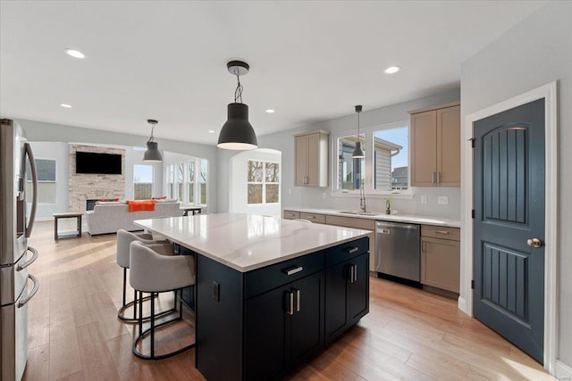 5 Canebrake Ct, Wentzville, MO 63385 - kitchen with appliances with stainless steel finishes, light countertops, healthy amount of natural light, light wood-type flooring, and recessed lighting