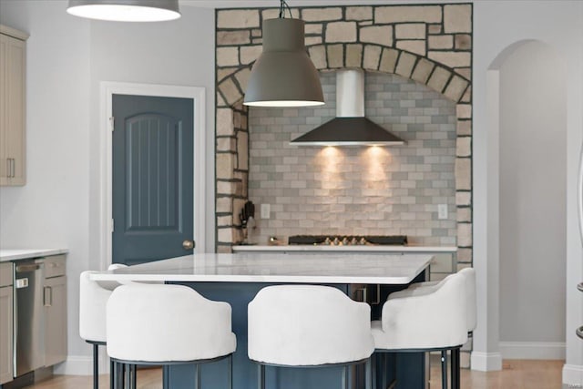 5 Canebrake Ct, Wentzville, MO 63385 - kitchen with wall chimney exhaust hood, light countertops, and backsplash