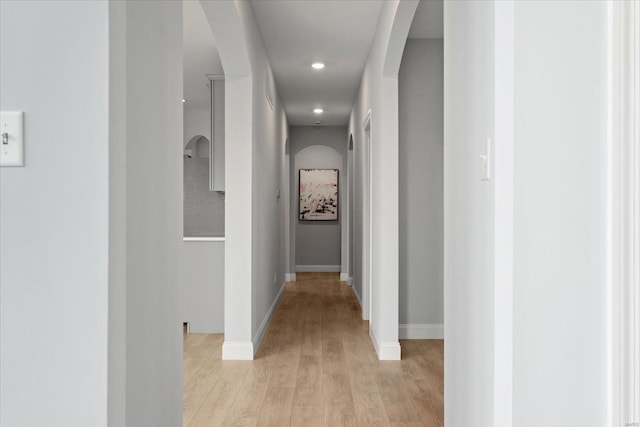 5 Canebrake Ct, Wentzville, MO 63385 - hall featuring arched walkways, light wood-style flooring, baseboards, and recessed lighting