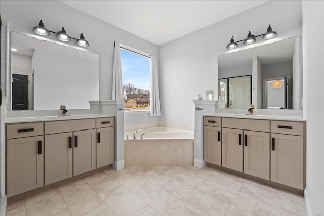 5 Canebrake Ct, Wentzville, MO 63385 - full bathroom with a garden tub, two vanities, and walk in shower