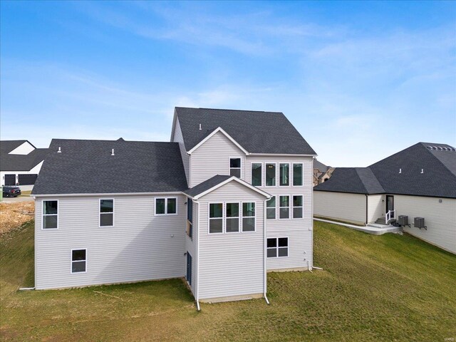 5 Canebrake Ct, Wentzville, MO 63385 - rear view of property featuring a yard and roof with shingles
