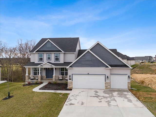 5 Canebrake Ct, Wentzville, MO 63385 - craftsman inspired home with stone siding, covered porch, an attached garage, and driveway