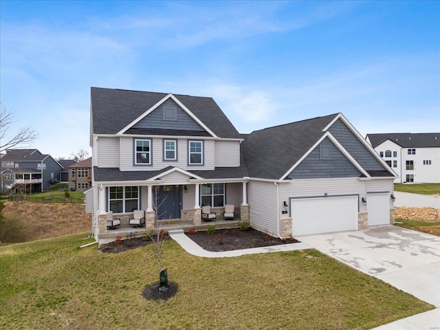 5 Canebrake Ct, Wentzville, MO 63385 - craftsman-style house with covered porch, stone siding, a garage, concrete driveway, and a front lawn