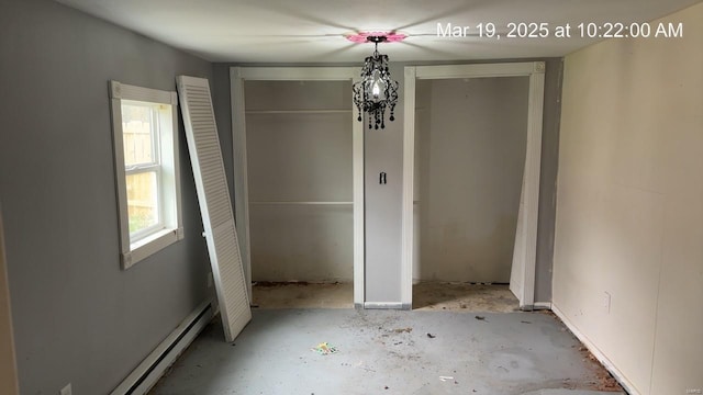 unfurnished dining area featuring a baseboard radiator