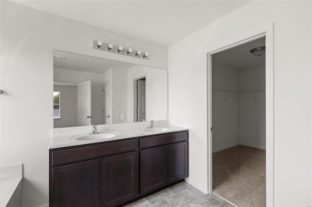 5048 Knotty Alder Dr, Imperial, MO 63052 - bathroom featuring double vanity and a spacious closet
