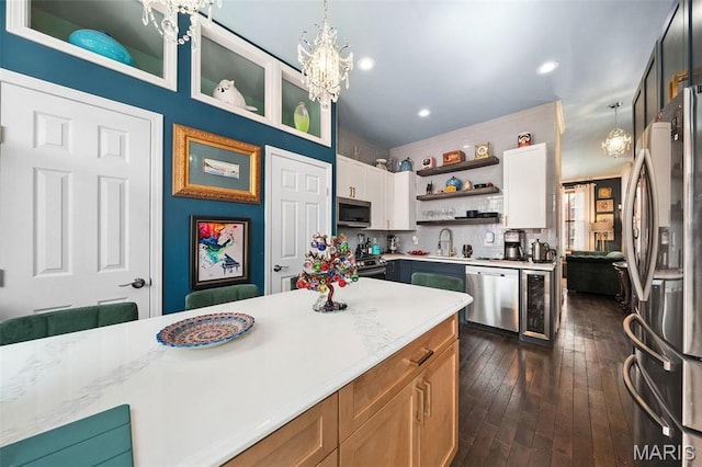 910 Rutger St, Saint Louis, MO 63104 - kitchen featuring stainless steel appliances, open shelves, a chandelier, a sink, and wine cooler