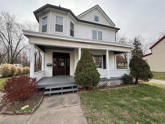 230 Lahaye St, Saint Genevieve, MO 63670 - view of front of home with covered porch and a front yard