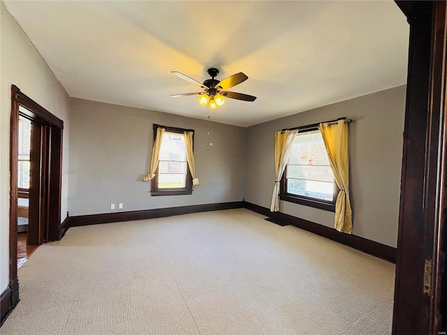 230 Lahaye St, Saint Genevieve, MO 63670 - empty room with light colored carpet, plenty of natural light, and baseboards