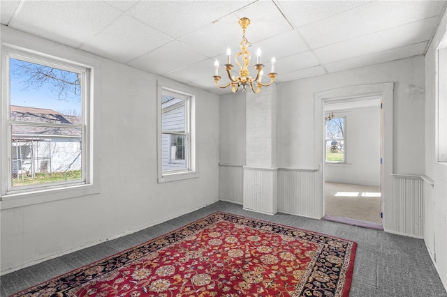 407 N Humboldt St, Marine, IL 62061 - unfurnished dining area featuring a paneled ceiling, a chandelier, and carpet