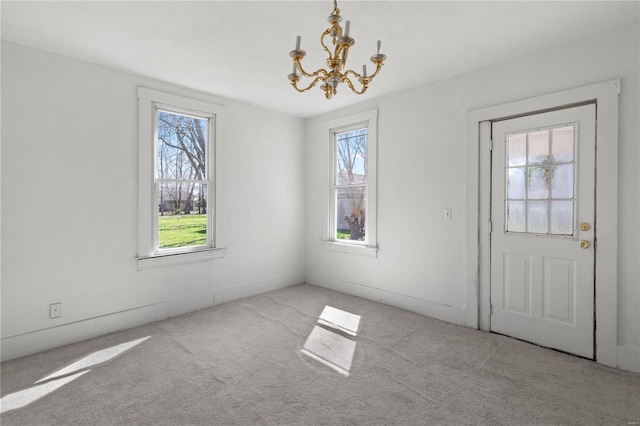 407 N Humboldt St, Marine, IL 62061 - unfurnished dining area featuring a chandelier and carpet floors