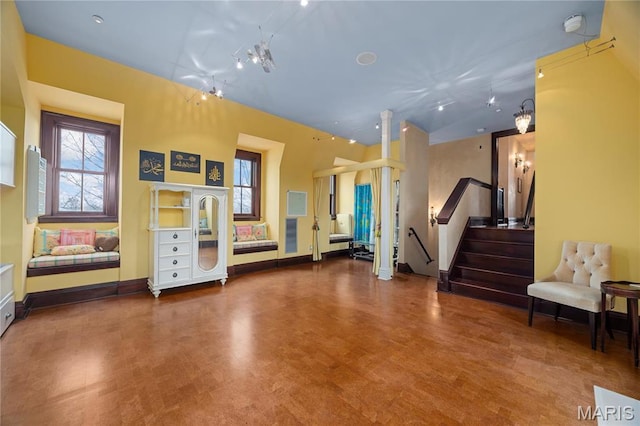 3520 Galt House Dr, Saint Charles, MO 63301 - living area featuring wood finished floors, stairway, and baseboards