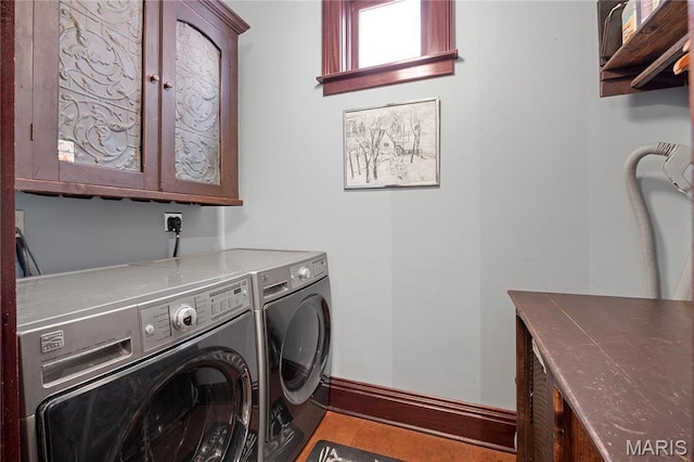 3520 Galt House Dr, Saint Charles, MO 63301 - laundry area featuring cabinet space, washing machine and dryer, and baseboards
