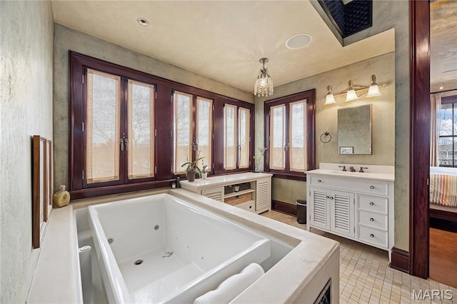 3520 Galt House Dr, Saint Charles, MO 63301 - full bathroom with plenty of natural light, vanity, a jetted tub, and a chandelier
