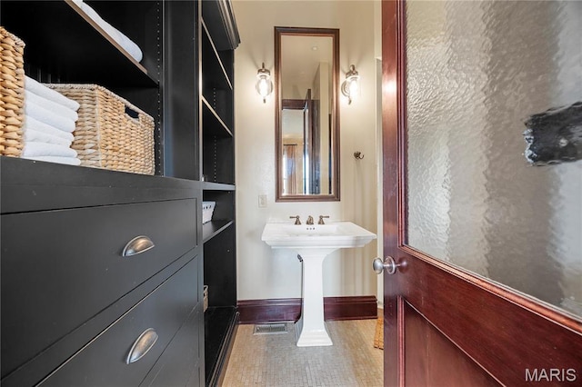 3520 Galt House Dr, Saint Charles, MO 63301 - bathroom featuring baseboards