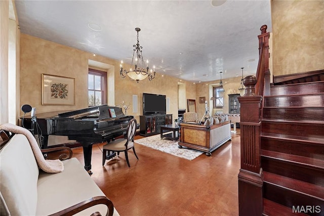 3520 Galt House Dr, Saint Charles, MO 63301 - living room featuring concrete floors and a chandelier