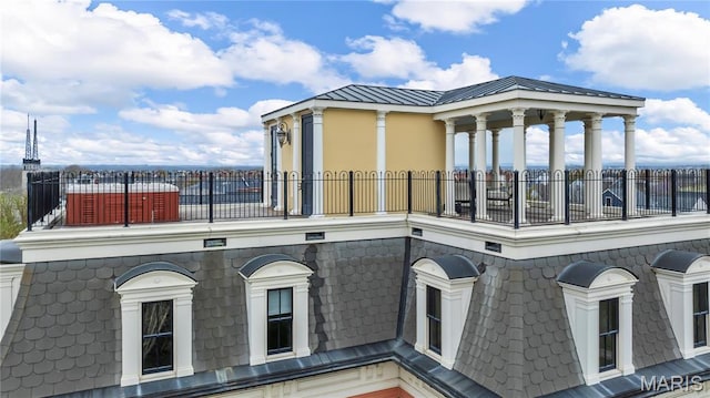 3520 Galt House Dr, Saint Charles, MO 63301 - view of side of home with a balcony, mansard roof, and metal roof