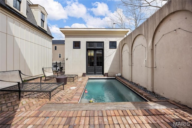 3520 Galt House Dr, Saint Charles, MO 63301 - swimming pool featuring a patio area, an outdoor structure, french doors, and an exterior structure