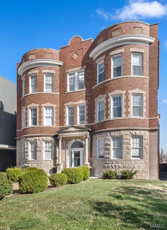 4319 Lindell Blvd Unit A, Saint Louis, MO 63108 - view of front of house with a front lawn and stone siding