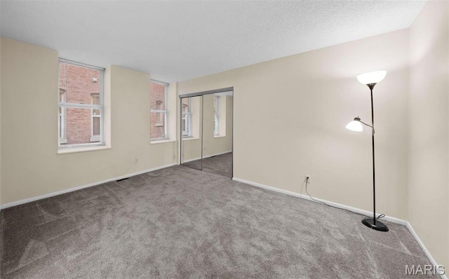 4319 Lindell Blvd Unit A, Saint Louis, MO 63108 - spare room featuring carpet flooring and baseboards