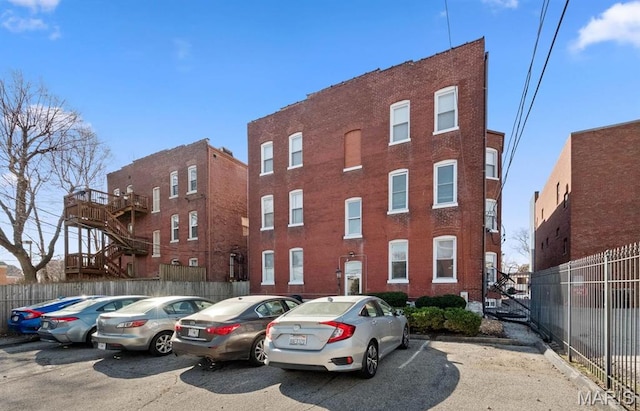 4319 Lindell Blvd Unit A, Saint Louis, MO 63108 - view of building exterior featuring uncovered parking and fence