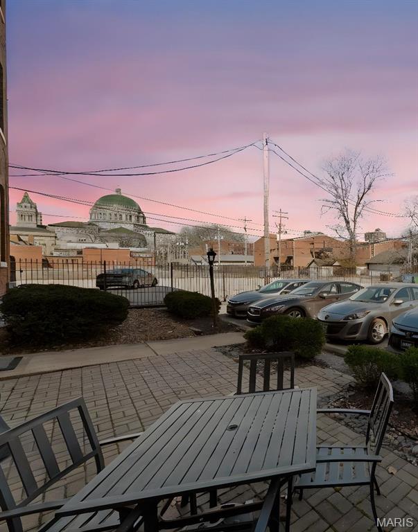 4319 Lindell Blvd Unit A, Saint Louis, MO 63108 - view of patio with outdoor dining space and fence