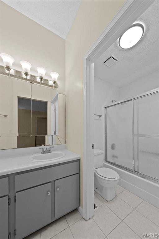 4319 Lindell Blvd Unit A, Saint Louis, MO 63108 - bathroom with tile patterned flooring, vanity, bath / shower combo with glass door, and a textured ceiling