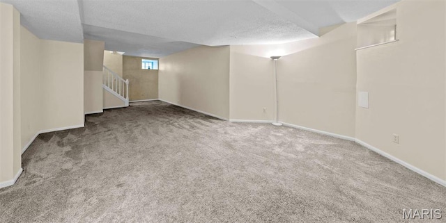 4319 Lindell Blvd Unit A, Saint Louis, MO 63108 - basement with carpet, a textured ceiling, and stairs