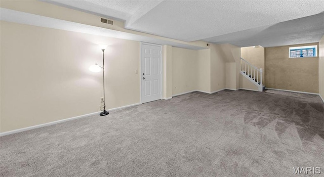4319 Lindell Blvd Unit A, Saint Louis, MO 63108 - below grade area with carpet flooring, a textured ceiling, and stairs