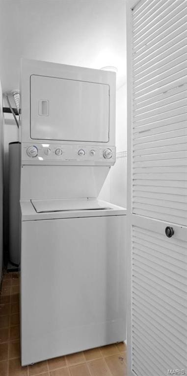 4319 Lindell Blvd Unit A, Saint Louis, MO 63108 - laundry room with stacked washer and clothes dryer and light tile patterned flooring