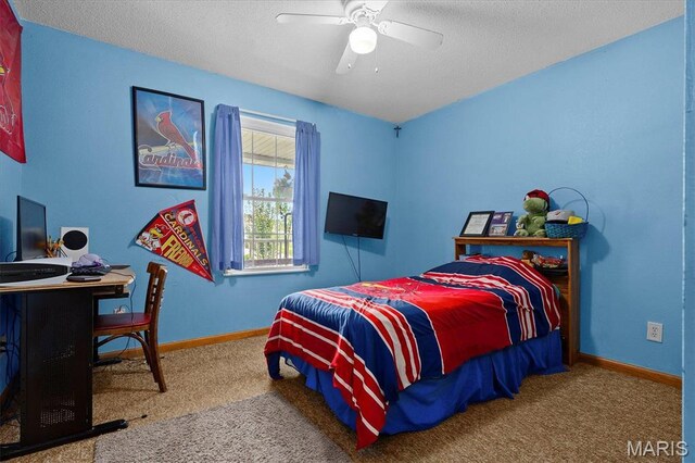 830 Wayne St, Carlyle, IL 62231 - carpeted bedroom featuring baseboards, a desk, a textured ceiling, and a ceiling fan