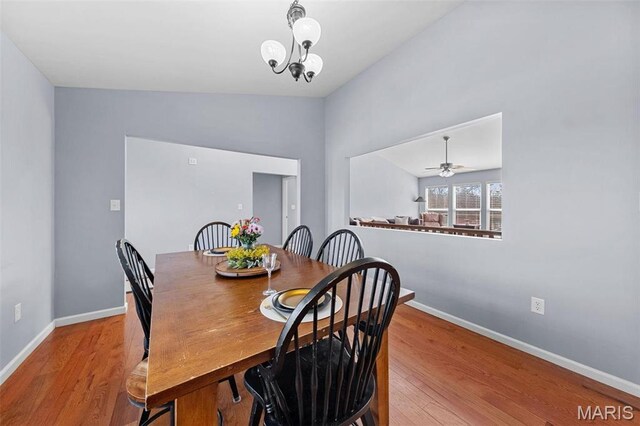 140 Shumard Oak Dr, Troy, MO 63379 - dining space with baseboards, wood finished floors, and lofted ceiling