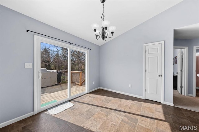 140 Shumard Oak Dr, Troy, MO 63379 - unfurnished dining area featuring vaulted ceiling, a chandelier, stone finish flooring, and baseboards