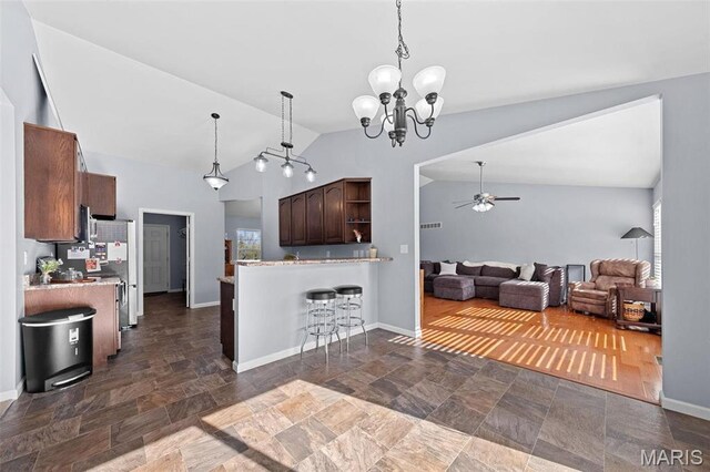 140 Shumard Oak Dr, Troy, MO 63379 - kitchen featuring vaulted ceiling, open shelves, dark stone finish flooring, ceiling fan, and light countertops