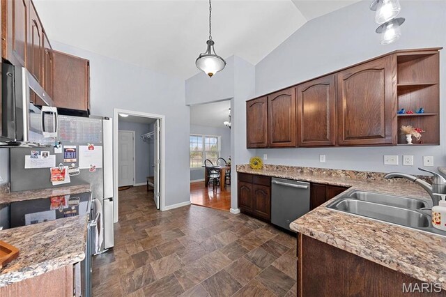 140 Shumard Oak Dr, Troy, MO 63379 - kitchen featuring stainless steel appliances, a sink, vaulted ceiling, hanging light fixtures, and stone finish floors