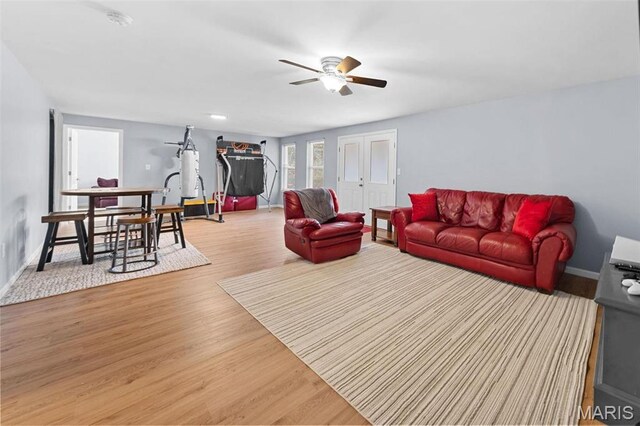 140 Shumard Oak Dr, Troy, MO 63379 - living area featuring a ceiling fan, wood finished floors, and baseboards